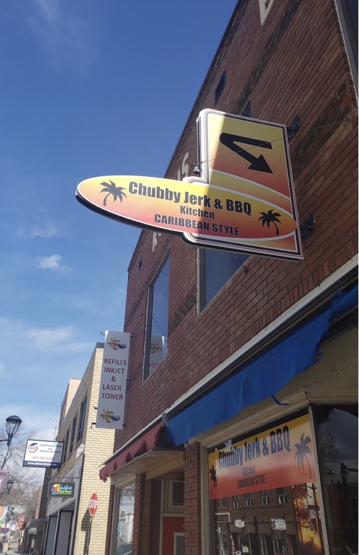 Chubby Jerk & BBQ Kitchen Caribbean Style sign on 50 Ave